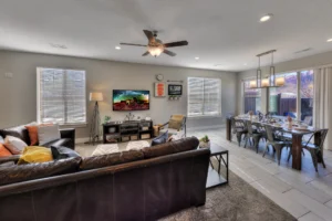 Dining area in an end-unit Entrada Moab townhome with seating for eight and views of red rock cliffs through the patio door.