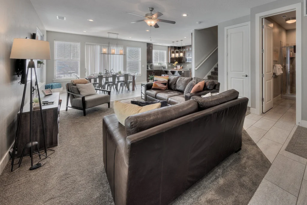 Open-concept living and dining area in a luxury Moab rental with leather sofas and easy social flow.