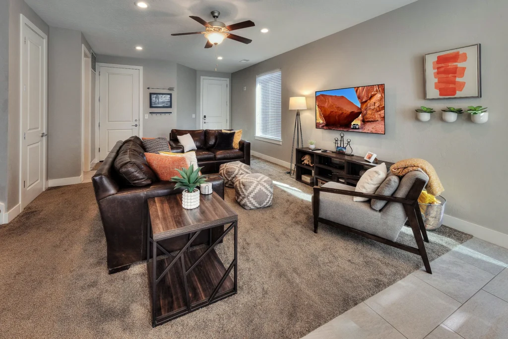 Wide view of the living room and entryway flow in a group-friendly Moab luxury townhome.