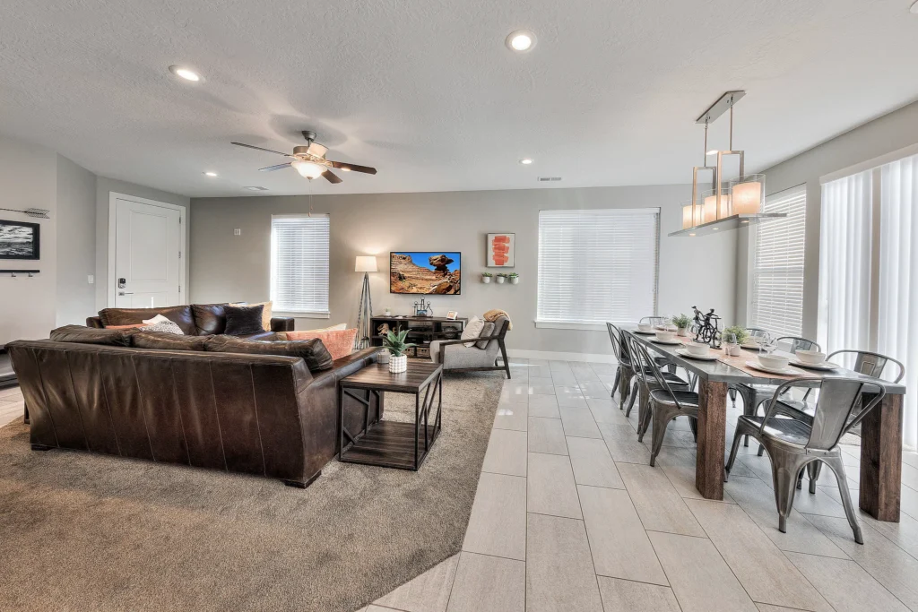 Open-concept dining and living area in Entrada 611 showing a scenic view of Long Canyon on the TV.