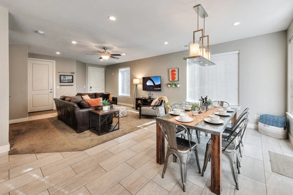 View from the dining area toward the living room and entryway in a Moab rental showing Corona Arch.