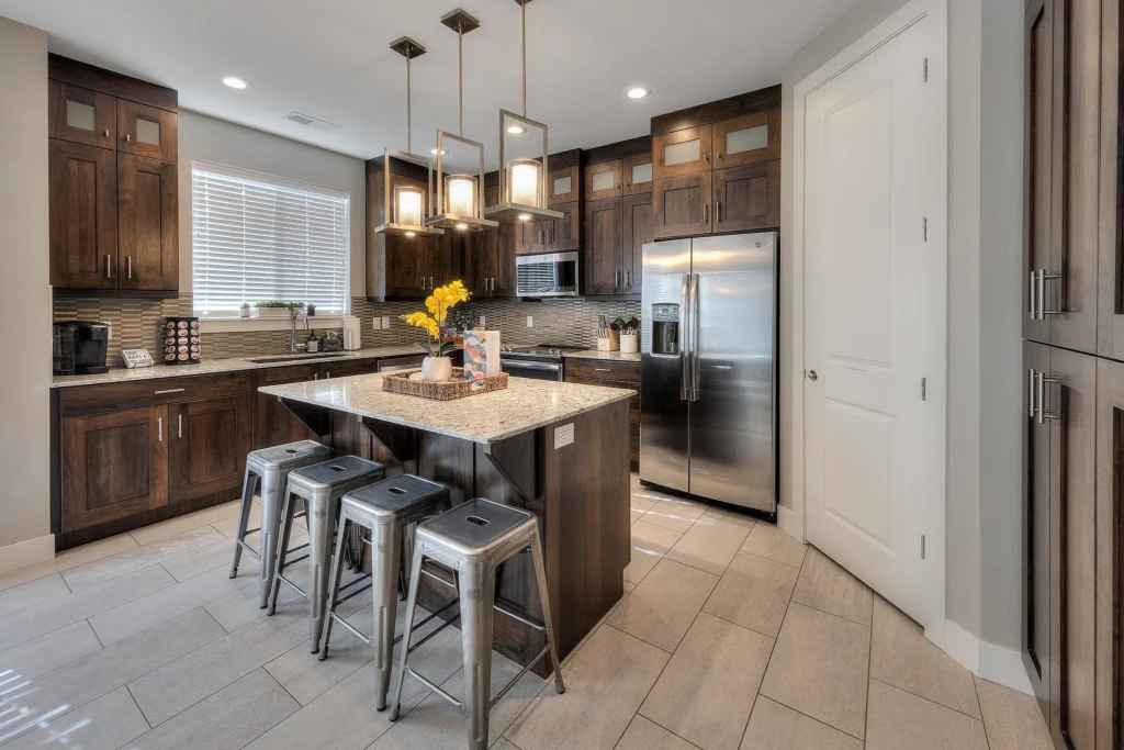 Kitchen island with breakfast bar stools in Entrada 611, located 10 minutes from Arches.