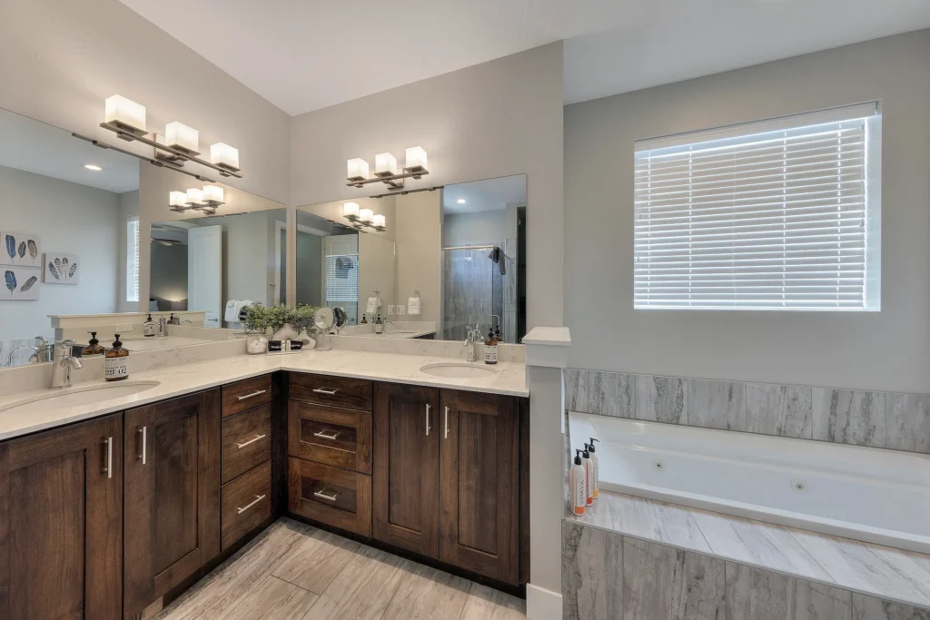 Master bathroom with dual vanity and jetted soaking tub in Entrada 611.