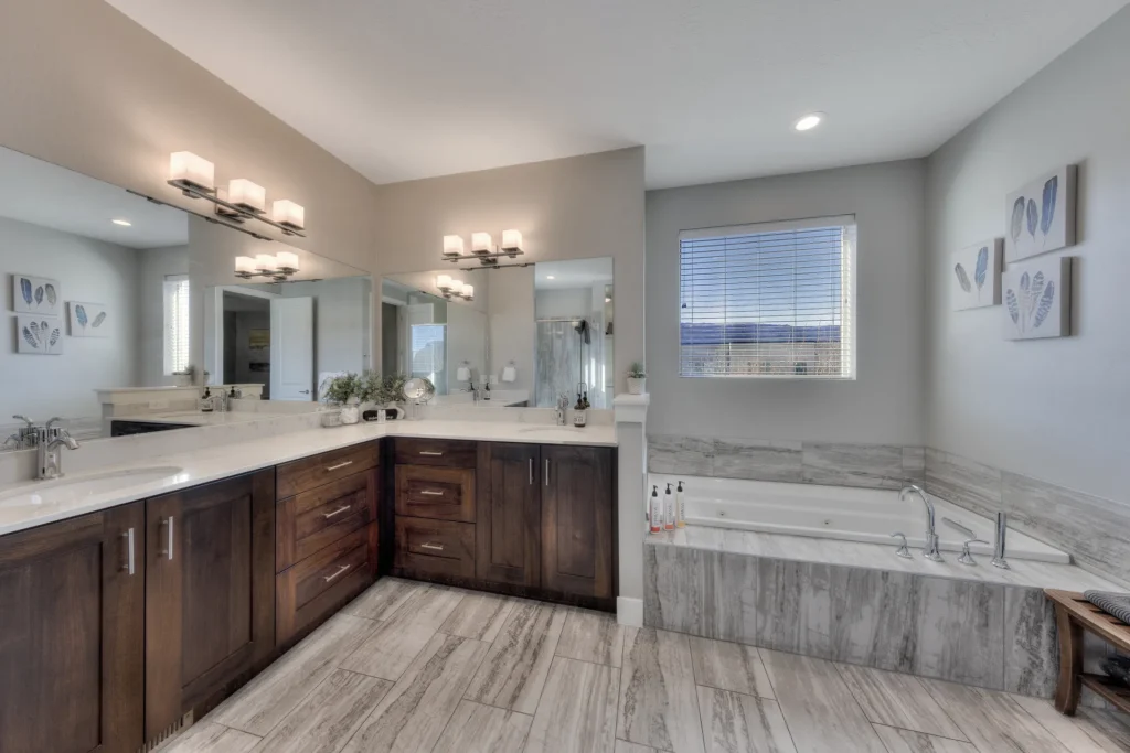 Luxury master ensuite in Entrada Moab Townhome 417 featuring a double vanity and custom dark wood cabinetry.