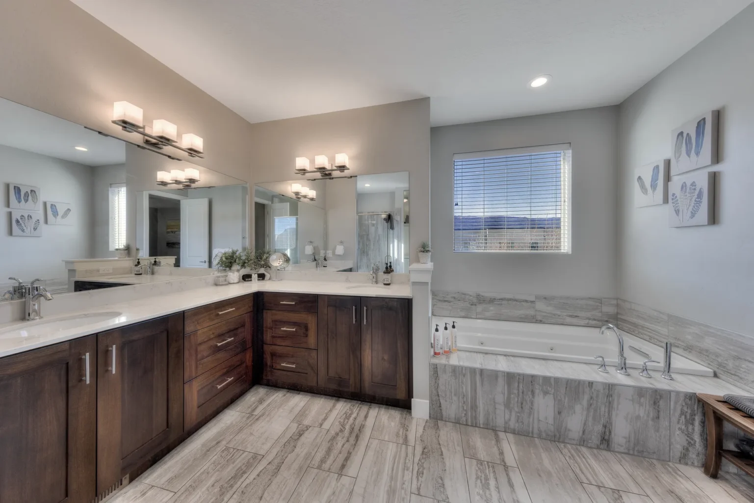 036-Entrada-Moab-417-MasterBathRoomWithJettedTub Luxury master ensuite in Entrada Moab Townhome 417 featuring a double vanity and custom dark wood cabinetry.