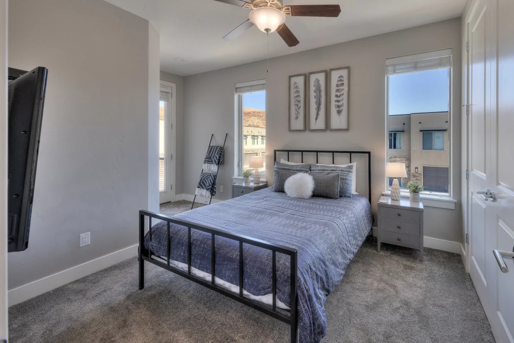 Queen bedroom in Entrada 611 Moab rental with luxury bedding and natural light.
