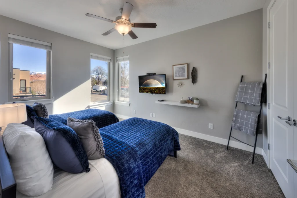 Smart TV displaying a digital landscape photograph of a rainbow over the desert near Torrey, Utah.