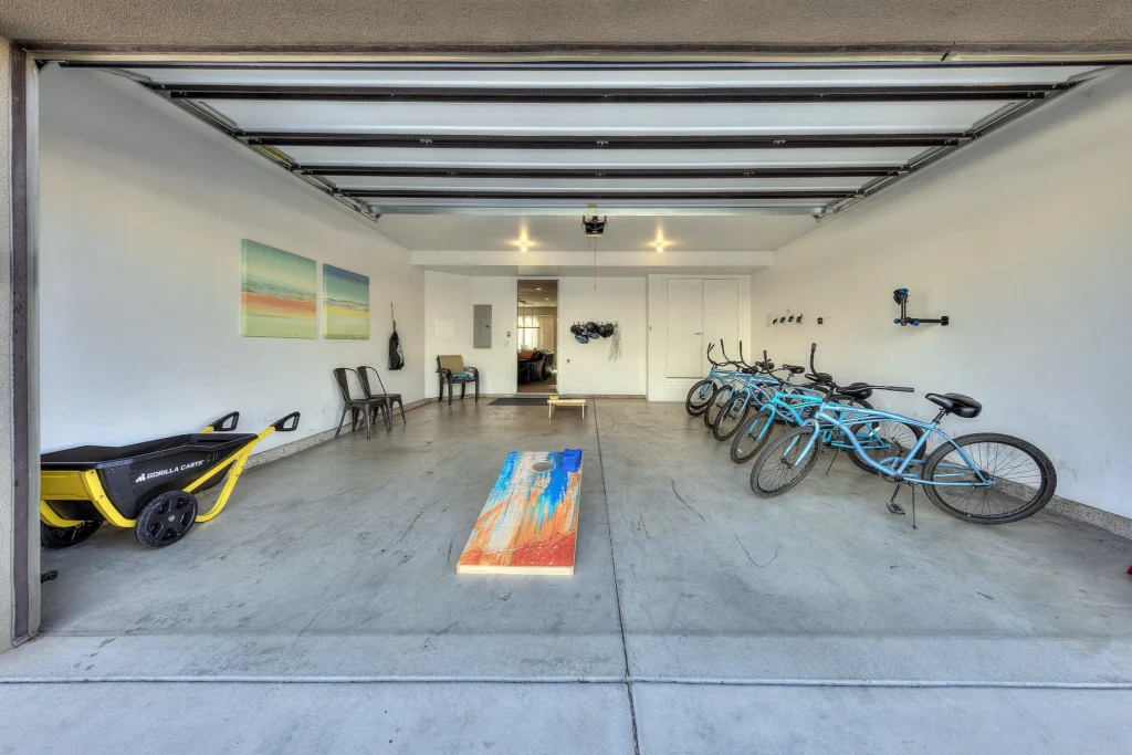 Spacious two-car garage for gear storage and recreation in a Moab luxury rental.