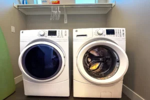 Full-size GE high-capacity front-load washer and dryer in a dedicated laundry room at Entrada Moab.